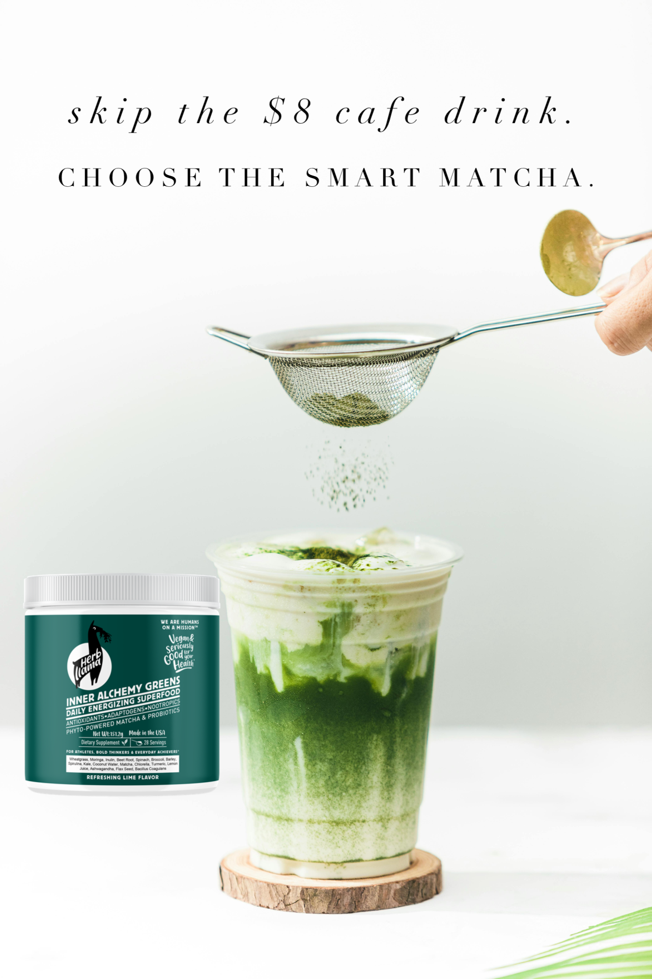 Matcha green tea being added to a glass with a container of matcha powder on a white background.